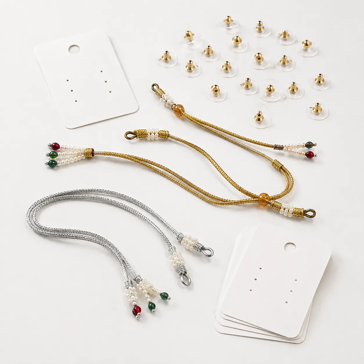 Representative jewellery accessories including dori earring backs and display cards